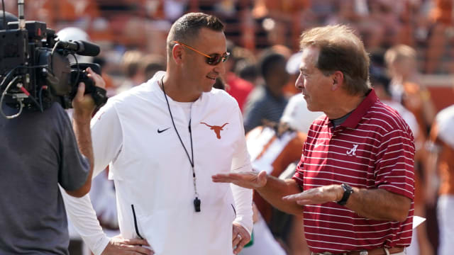 Texas Longhorns head coach Steve Sarkisian talks with Alabama Crimson Tide head coach Nick Saban before the game at Darrell K Royal-Texas Memorial Stadium.